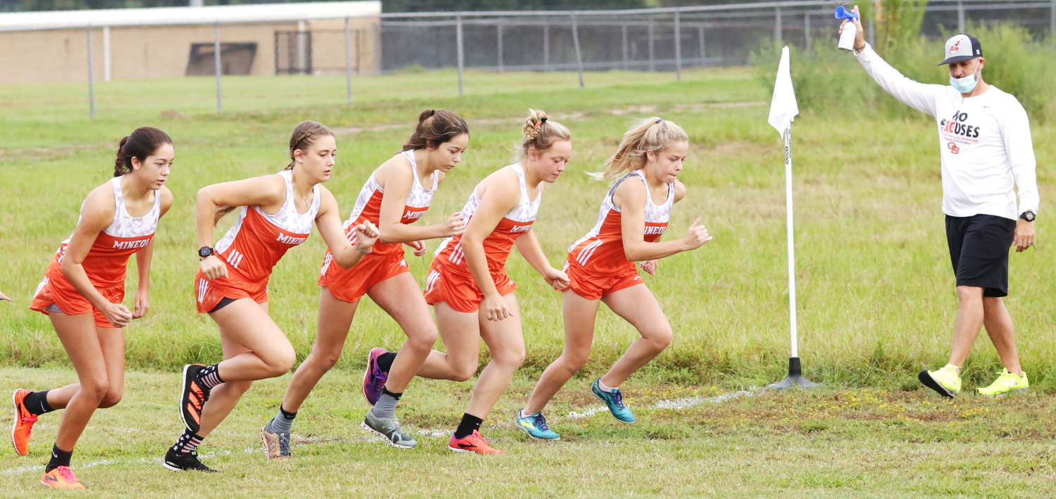 The winning Lady Jacket cross country team at the start of last Thursday’s Mineola Invitational. (Monitor photo by John Arbter)